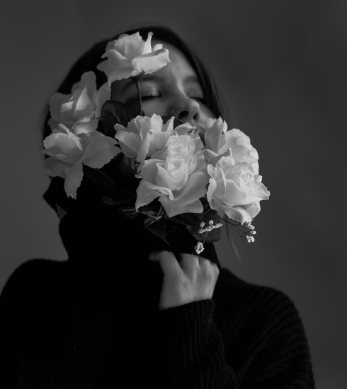 Black and white picture of a woman with flowers