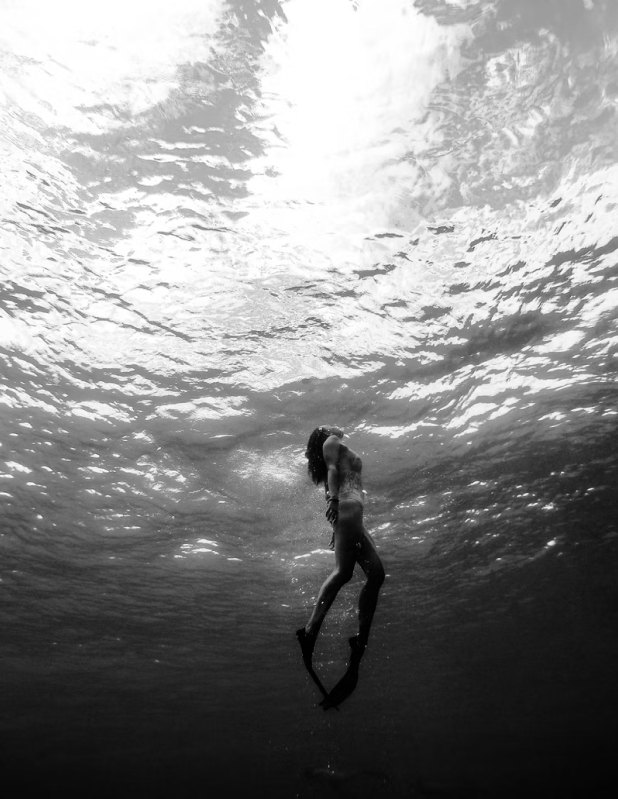 Woman swimming with flaps on her legs